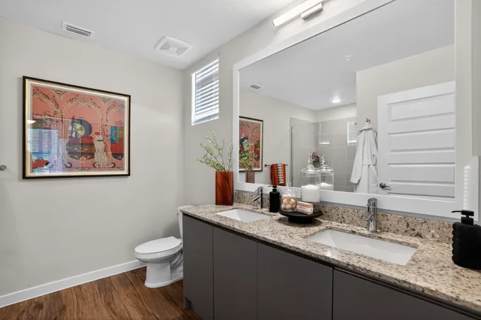 Bathroom vanity and mirror at Entrada Apartments, Cape Coral