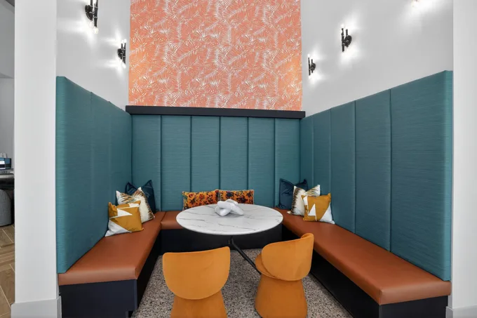 Built-in seating nook with a round table at Entrada Apartments, Cape Coral