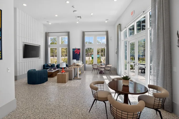 Window-lined lounge and work area at Entrada Apartments, Cape Coral