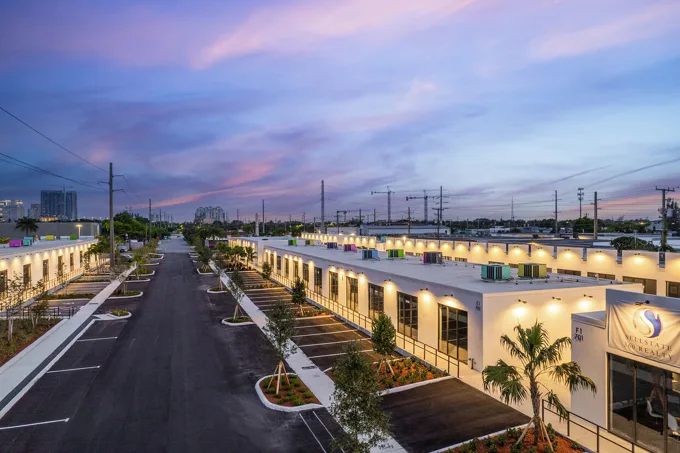 Commercial buildings and parking at dusk at Thrive Art District, Fort Lauderdale