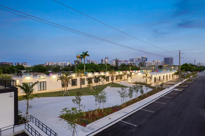 Commercial buildings and central courtyard at twilight at Thrive Art District, Fort Lauderdale