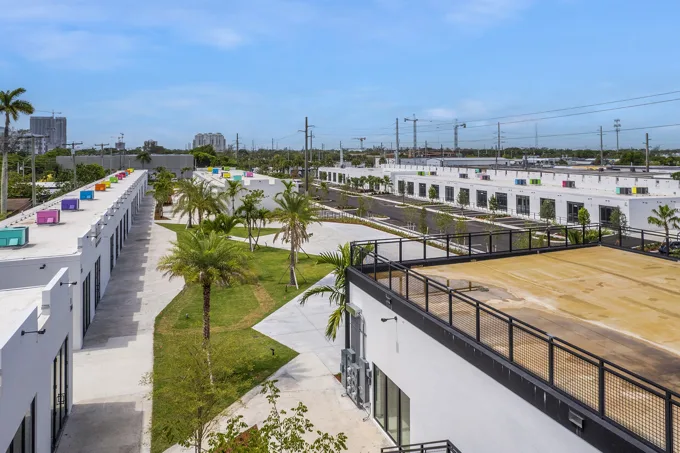 Landscaped central courtyard between commercial buildings at Thrive Art District, Fort Lauderdale