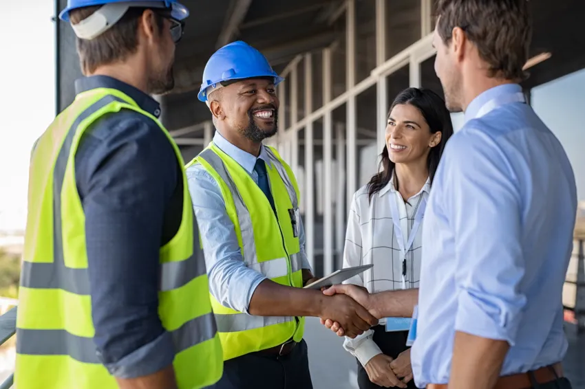Owners and construction professionals meeting to align the project team
